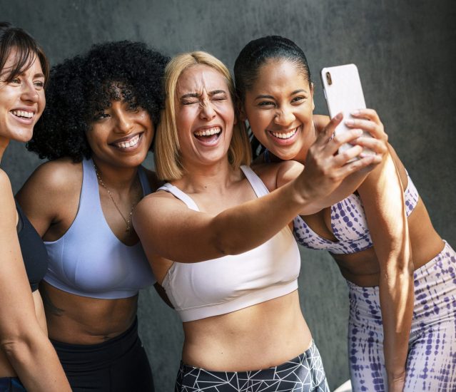 Cheerful sporty women taking a selfie